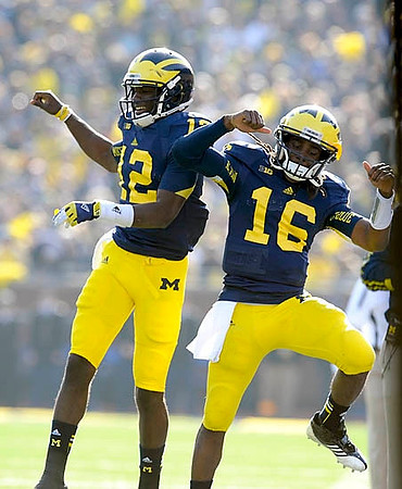 Devin Gardner (12) and Denard Robinson (16)