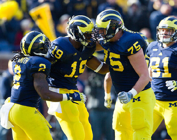 Vincent Smith (2), Devin Funchess (19), Michael Schofield (75), and Mike Kwiatkowski (81)