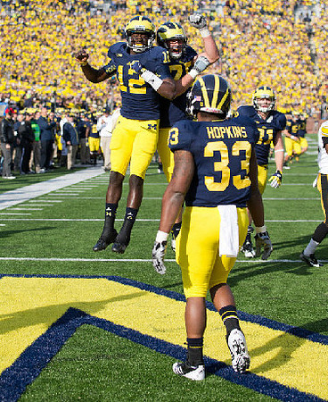 Devin Gardner (12), Stephen Hopkins (33), Michael Schofield (75), and Mike Kwiatkowski (81)