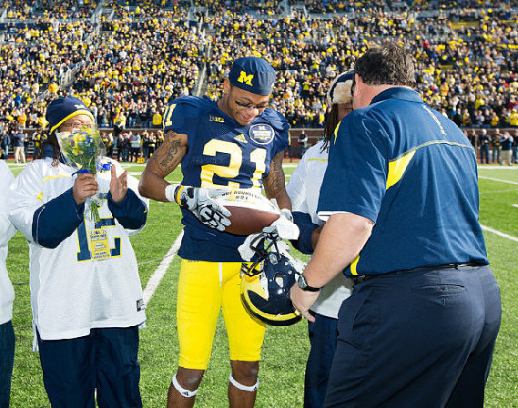 Roy Roundtree (21) and Brady Hoke