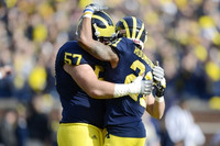 Elliott Mealer (57) and Roy Roundtree (21)