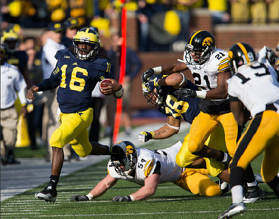 Denard Robinson (16) and Thomas Rawls (38)