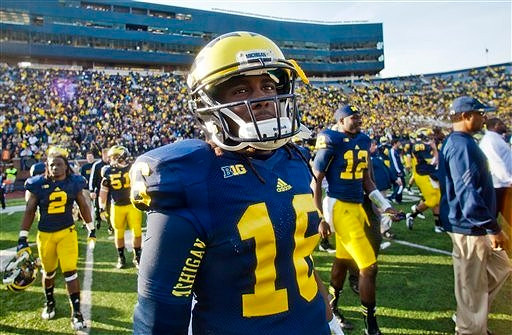 Vincent Smith (2), Denard Robinson (16), Bobby Henderson (51), and Devin Gardner (12)
