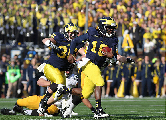 Joe Kerridge (36) and Denard Robinson (16)