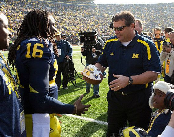 Denard Robinson (16) and Brady Hoke