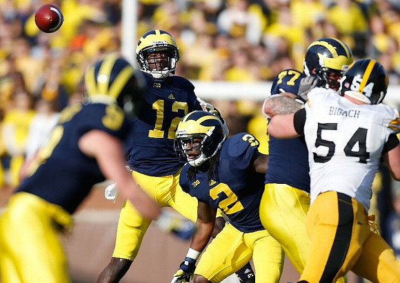Drew Dileo (9), Devin Gardner (12), Vincent Smith (2), and Taylor Lewan (77)