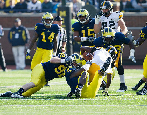 Josh Furman (14), Keith Heitzman (92), James Ross (15), and Quinton Washington (76)