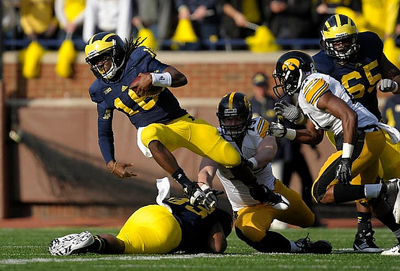 Denard Robinson (16) and Stephen Hopkins (33)