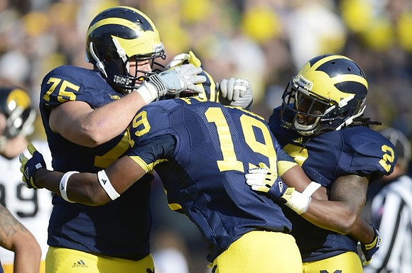 Michael Schofield (75), Devin Funchess (19), and Vincent Smith (2)