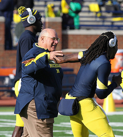 Al Borges, Denard Robinson (16), and Devin Gardner (12)