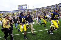 Denard Robinson (16), Martell Webb (80), and Kelvin Grady (19)