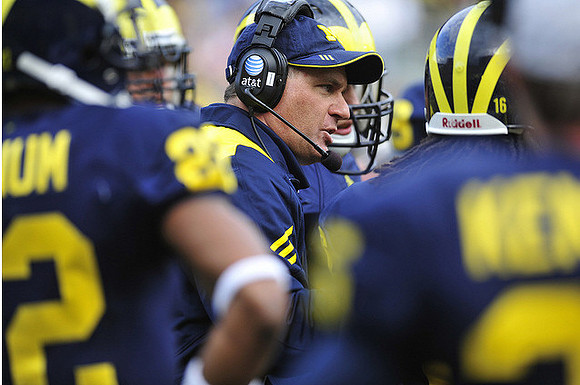 Rich Rodriguez, Denard Robinson (16), and Darryl Stonum (22)