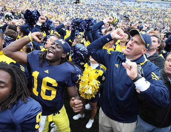 Martavious Odoms (9), Denard Robinson (16), and Rich Rodriguez