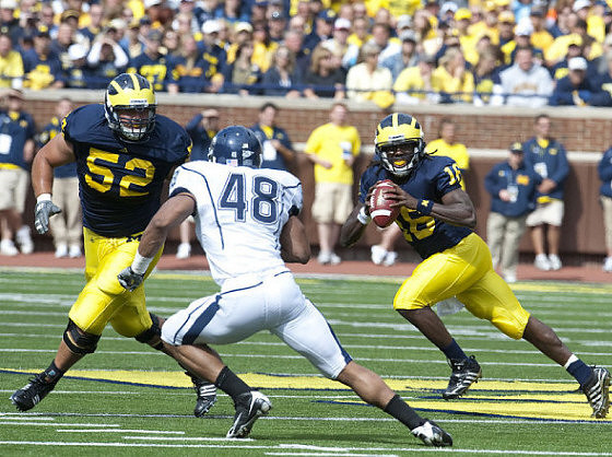 Stephen Schilling (52) and Denard Robinson (16)