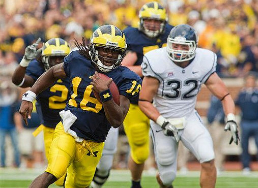 Denard Robinson (16) and Darryl Stonum (22)