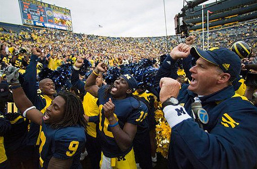 Martavious Odoms (9), Denard Robinson (16), and Rich Rodriguez