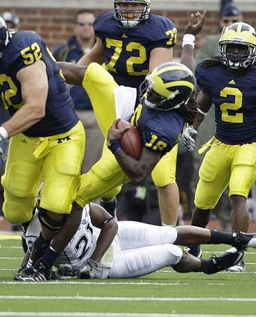 Stephen Schilling (52), Mark Huyge (72), Denard Robinson (16), and Vincent Smith (2)