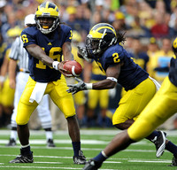 Denard Robinson (16) and Vincent Smith (2)