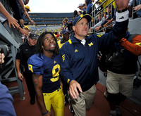 Martavious Odoms (9) and Rich Rodriguez