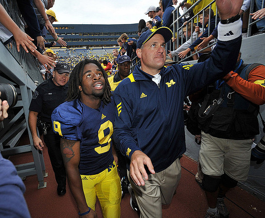 Martavious Odoms (9) and Rich Rodriguez