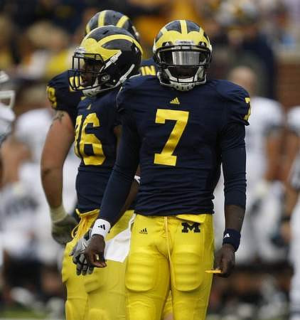 Perry Dorrestein (79), Kevin Koger (86), and Devin Gardner (7)