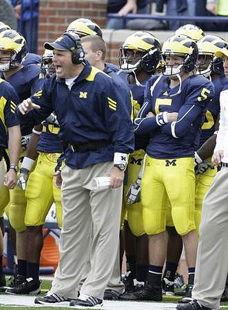 Rich Rodriguez and Tate Forcier (5)