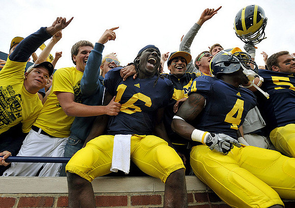 Denard Robinson (16), Cameron Gordon (4), and Ryan Van Bergen (53)