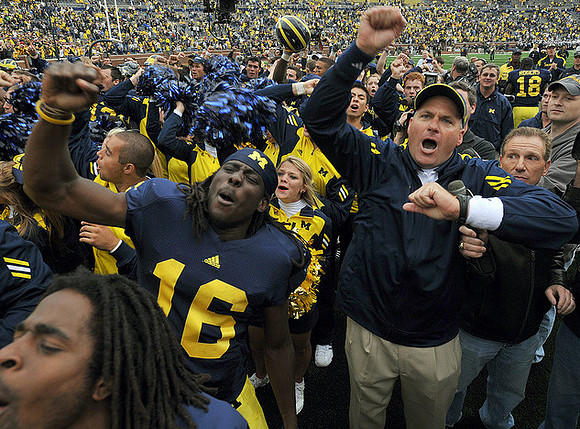 Denard Robinson (16) and Rich Rodriguez