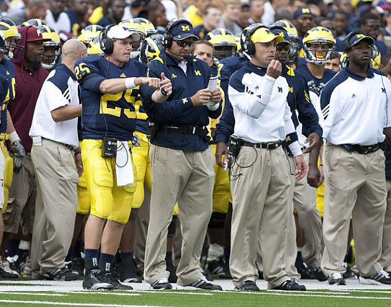 Jack Kennedy (25) and Rich Rodriguez