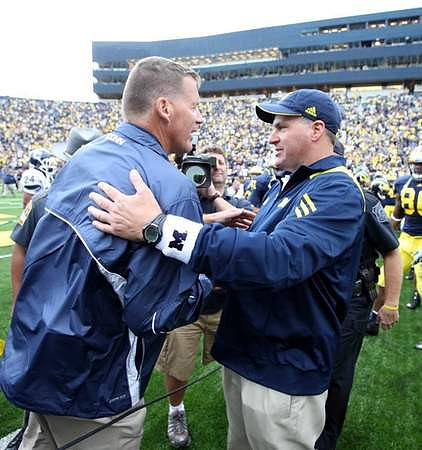 Randy Edsall and Rich Rodriguez