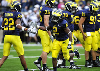 Darryl Stonum (22), Vincent Smith (2), Michael Schofield (75), Quinton Washington (76), and Tom Pomarico (91)