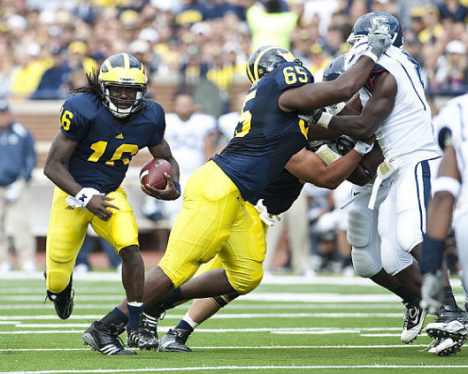 Denard Robinson (16) and Patrick Omameh (65)