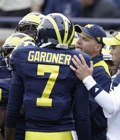 Devin Gardner (7) and Rich Rodriguez