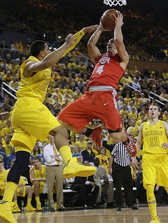 Jordan Morgan (52) and Nik Stauskas (11)