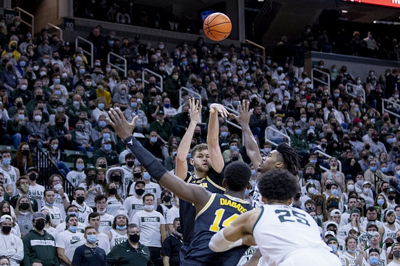 Hunter Dickinson (1) and Moussa Diabate (14)