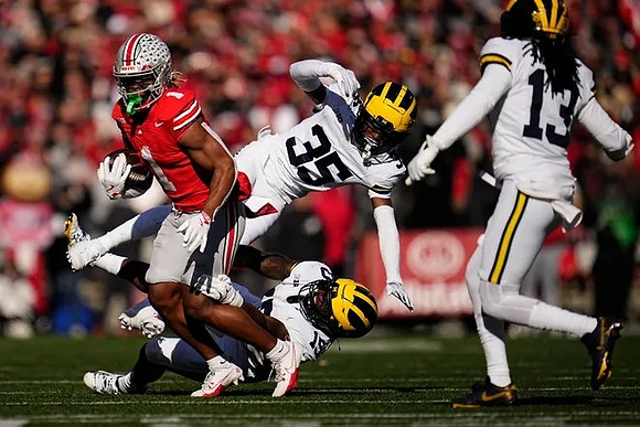 Jyaire Hill (35), Wesley Walker (13), and Ernest Hausmann (15)