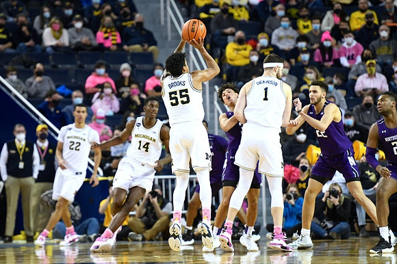 Caleb Houstan (22), Moussa Diabate (14), Eli Brooks (55), and Hunter Dickinson (1)