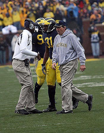 Lloyd Carr, Brandent Englemon, Ron English, and Tim Jamison