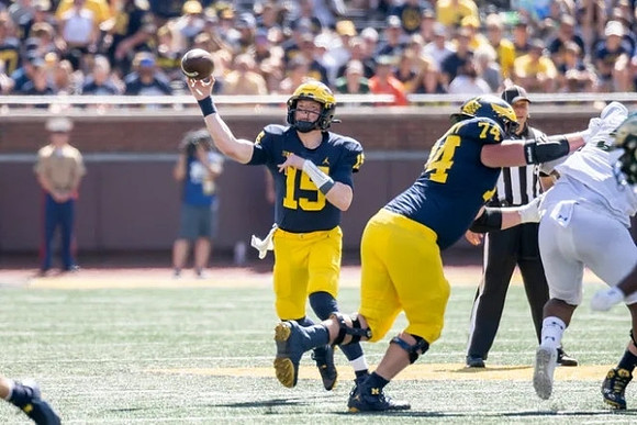 Alan Bowman (15) and Reece Atteberry (74)
