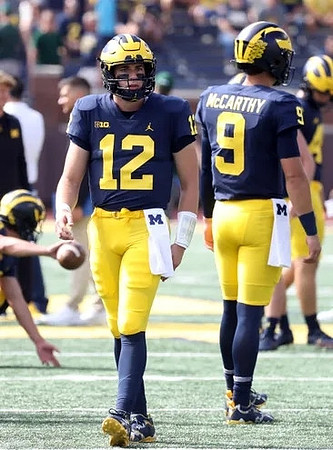 Cade McNamara (12) and J.J. McCarthy (9)