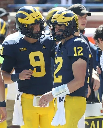 J.J. McCarthy (9) and Cade McNamara (12)