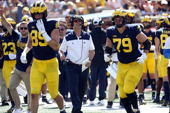 Carter Selzer (89), Jim Harbaugh, and Jeffrey Persi (79)
