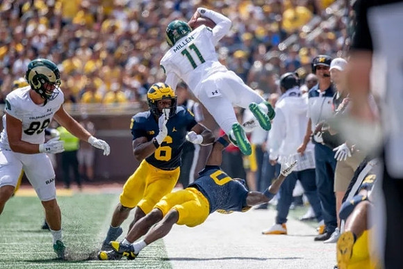 R.J. Moten (6) and Mike Sainristil (0)