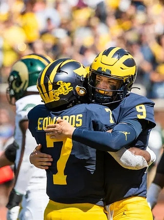 Donovan Edwards (7) and J.J. McCarthy (9)