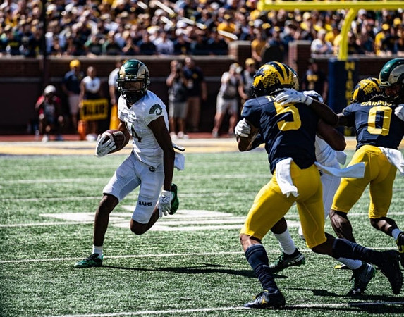 DJ Turner (5) and Mike Sainristil (0)
