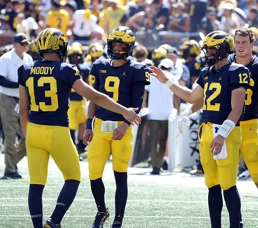 Jake Moody (13), J.J. McCarthy (9), and Cade McNamara (12)