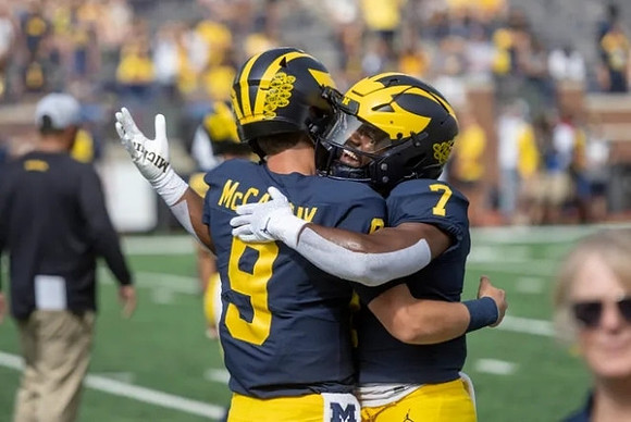 J.J. McCarthy (9) and Donovan Edwards (7)