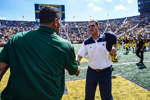Colorado State Head Coach Jay Norvell and Jim Harbaugh