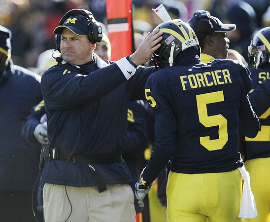 Rich Rodriguez and Tate Forcier (5)