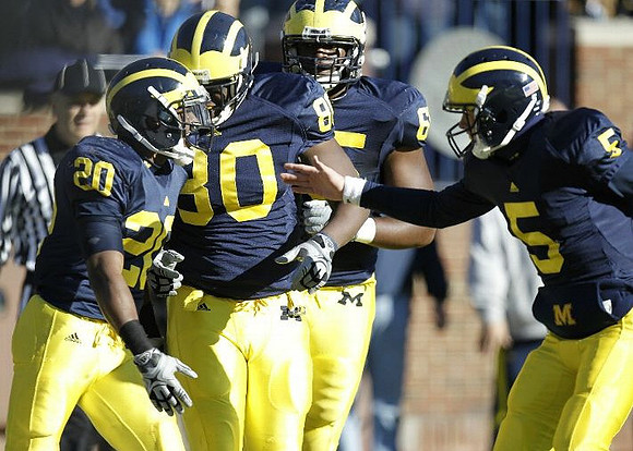Michael Shaw (20), Martell Webb (80), Patrick Omameh (65), and Tate Forcier (5)